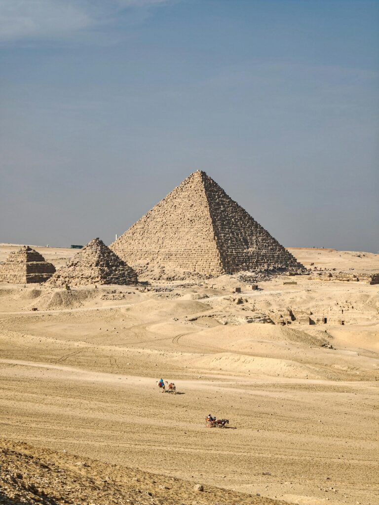 The Great Pyramid of Giza under a clear sky, showcasing Egypt's ancient architecture.