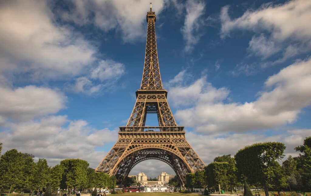 A breathtaking view of the Eiffel Tower against a blue sky in Paris, France.